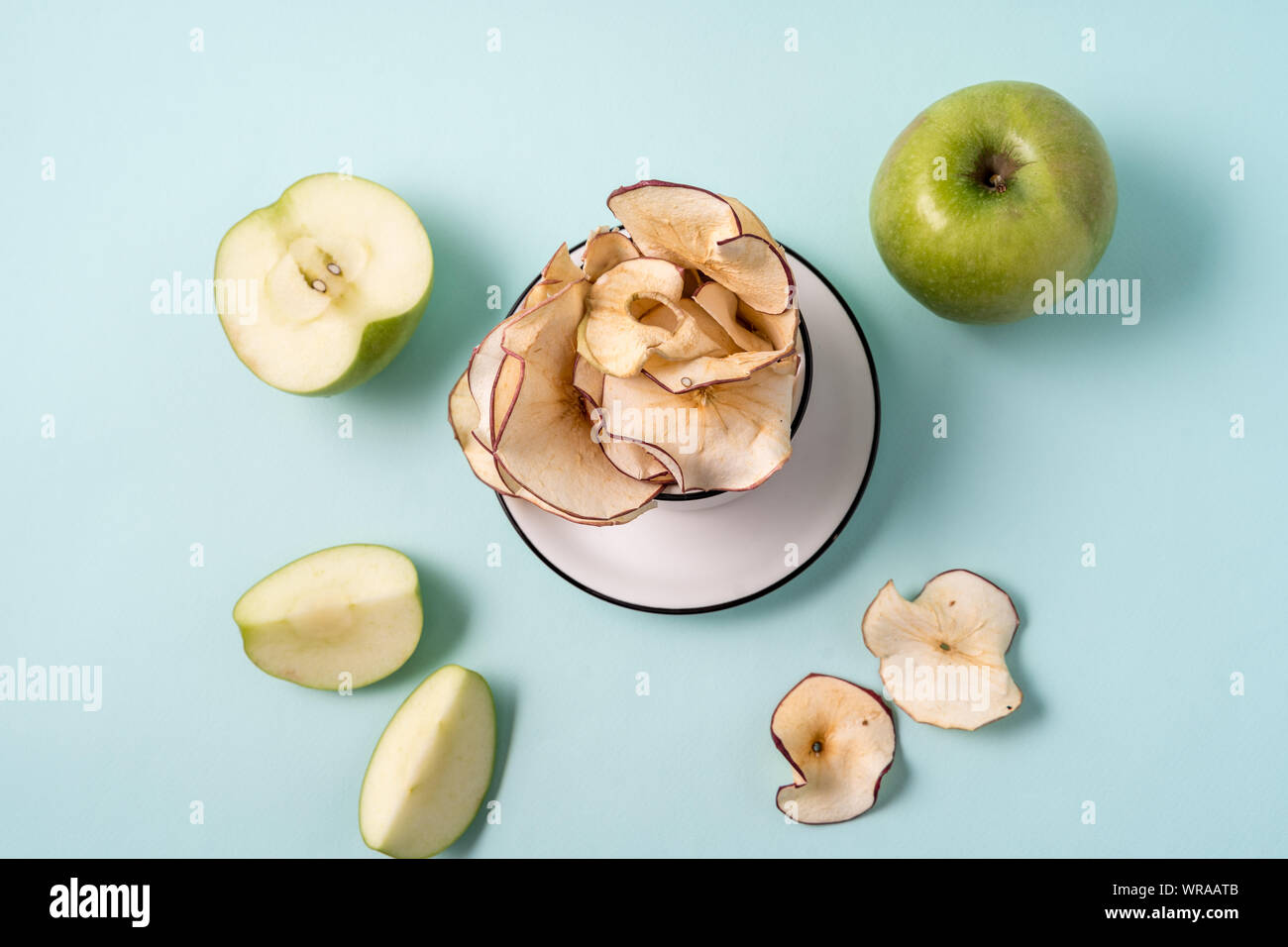 Flat Lay Dried Apple Chips In A Cup And Fresh Apples Over Light