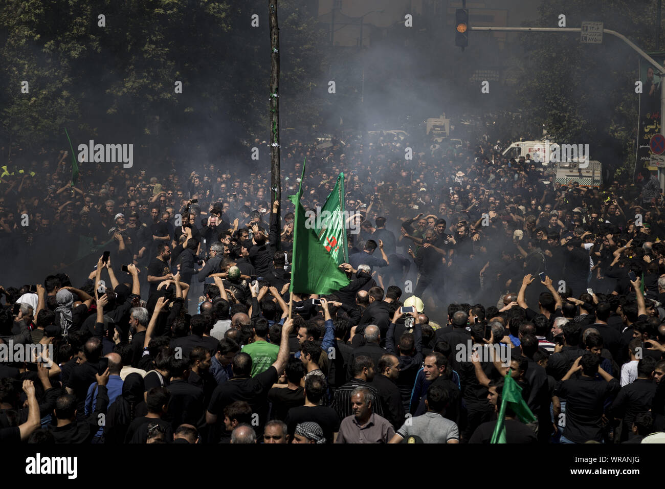 September 10, 2019, Tehran, Tehran, Iran: Iranians burn a tent as they perform at the Ashura ceremonies in Tehran, Iran. The Ashura day commemorates the death anniversary of the third Shiite Imam Hussein, who was the grandson of Muslim Prophet Muhammed. Ashura is the peak of ten days of mourning when Shiite Muslims mourn the killing of Imam Hussein whose shrine is in Karbala in southern Iraq. (Credit Image: © Rouzbeh Fouladi/ZUMA Wire) Stock Photo