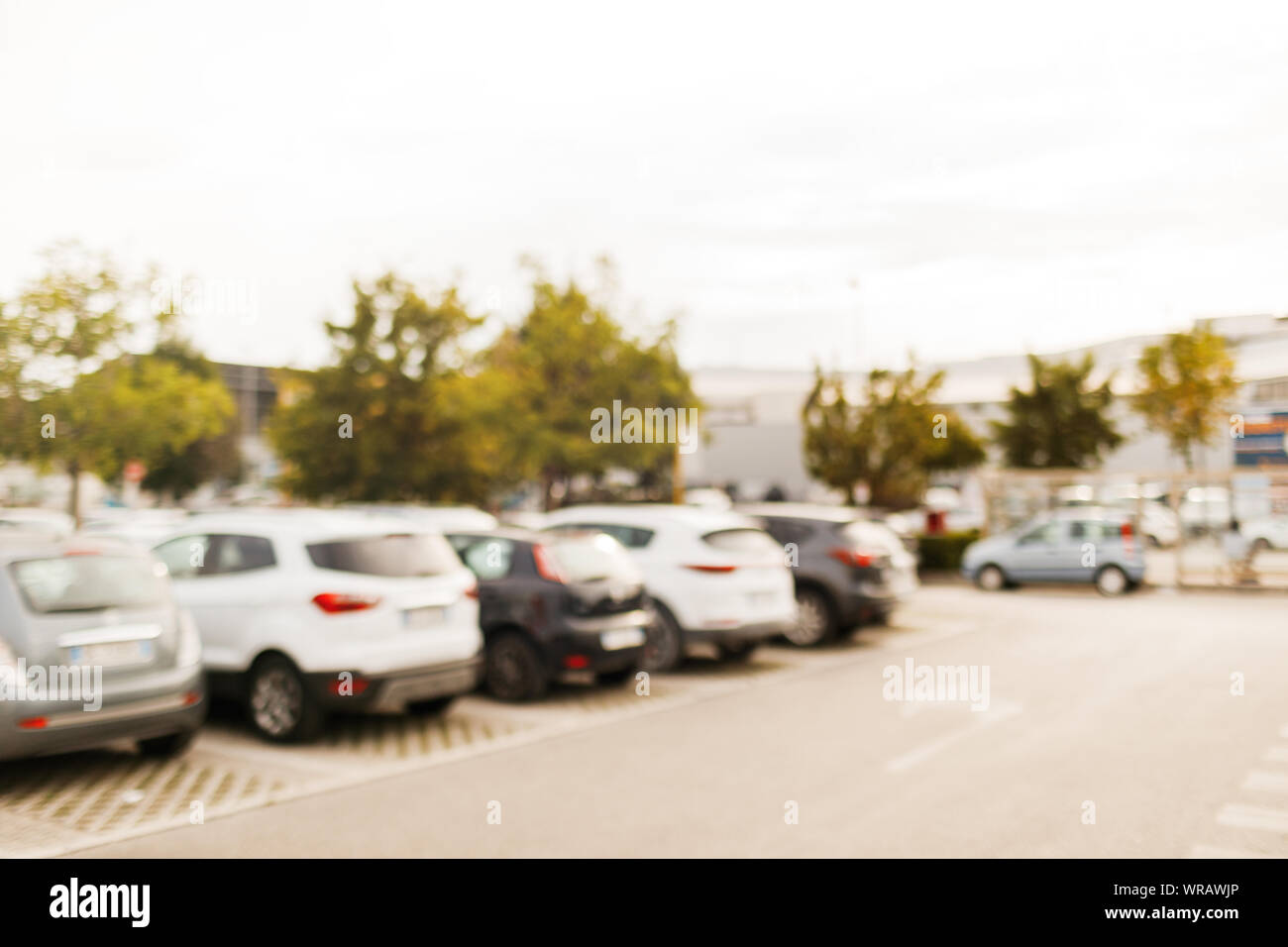 Photo of blurred parking cars near the supermarket. Stock Photo