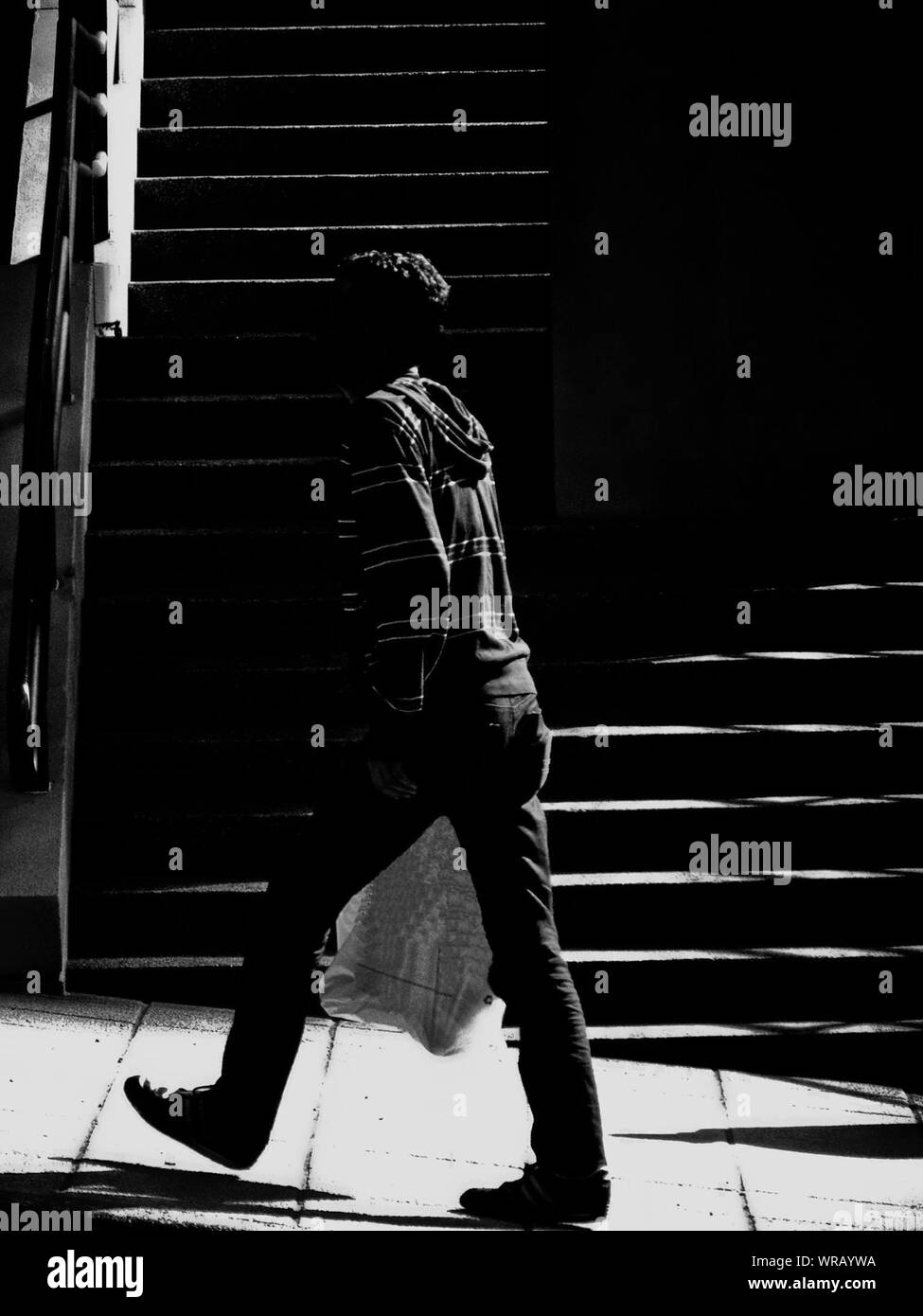 Man walking with bag hi-res stock photography and images - Alamy