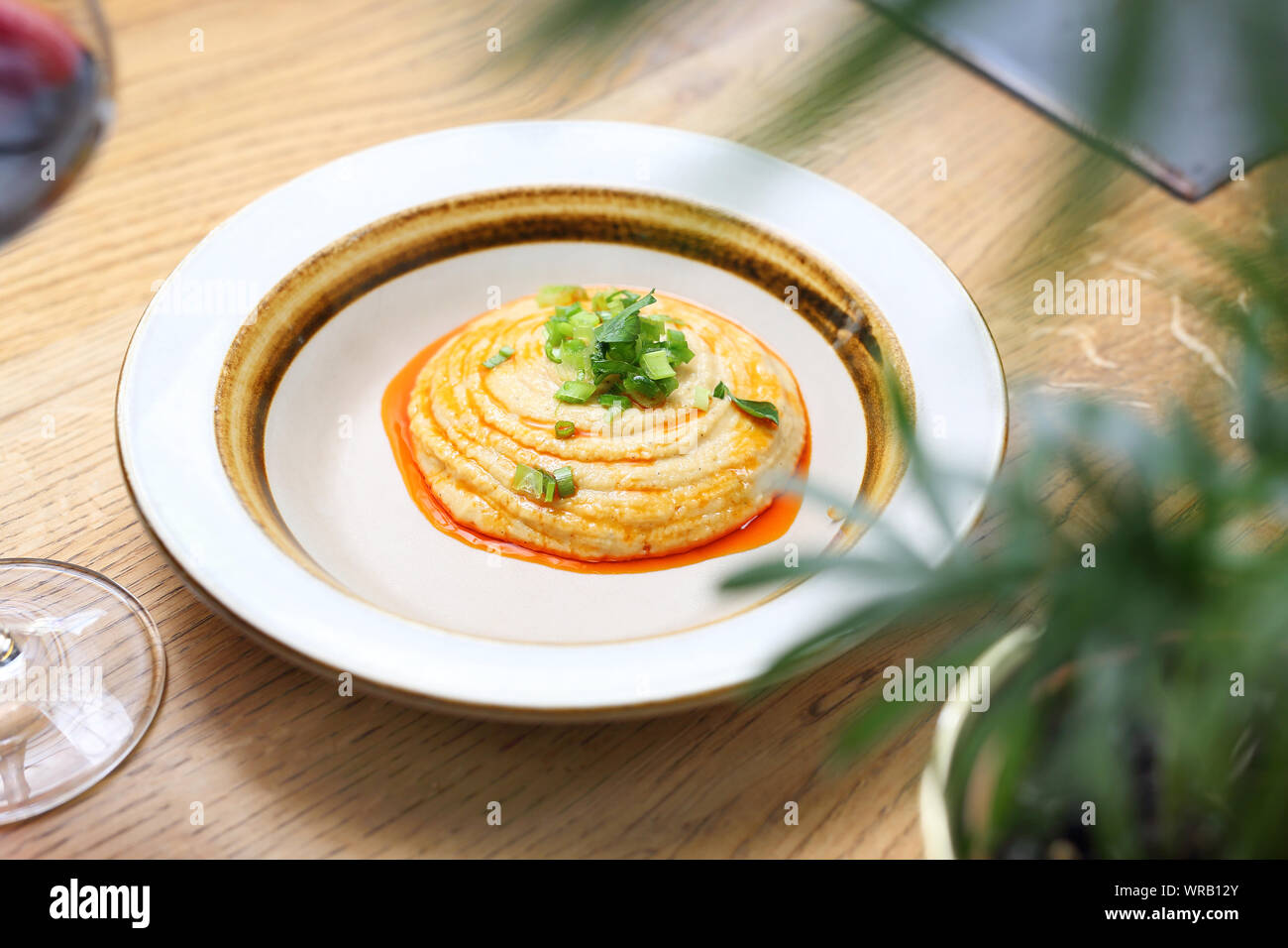 Arabic cuisine chickpea paste and roasted onion. Stock Photo