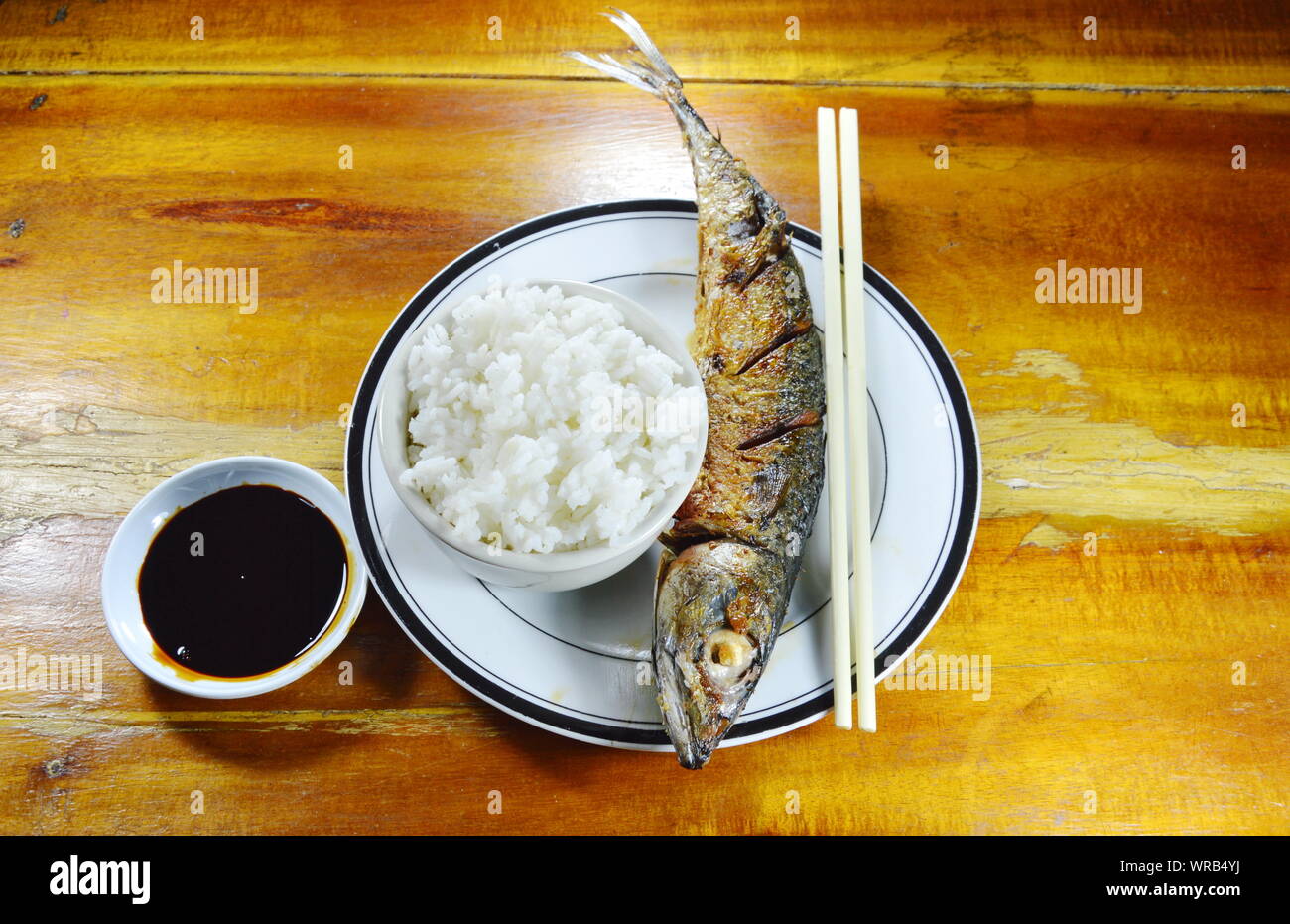 fried pacific mackerel eat with plain rice and sweet black soy sauce