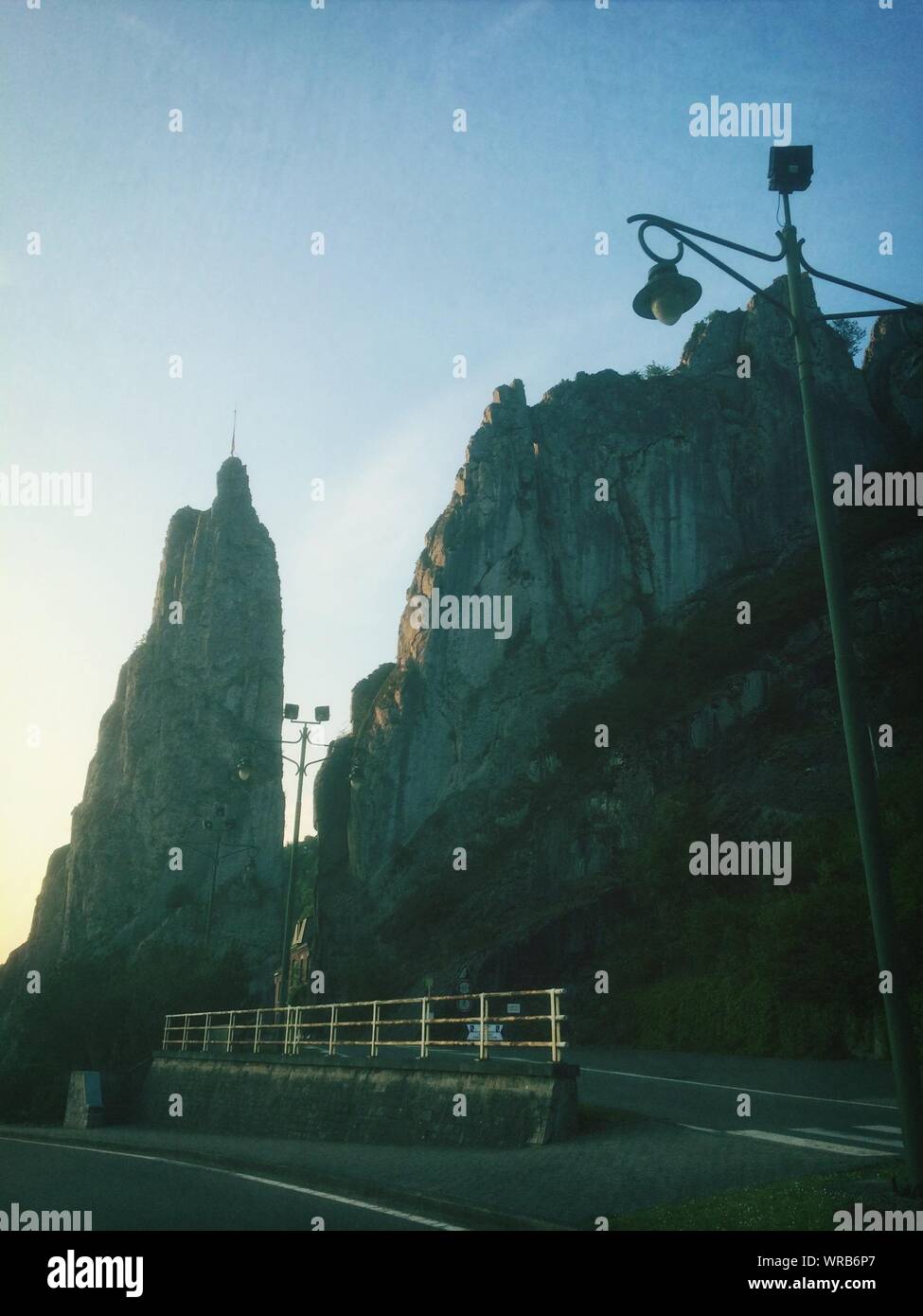 Road Leading Through Two Immense Wall Of Rocks Stock Photo