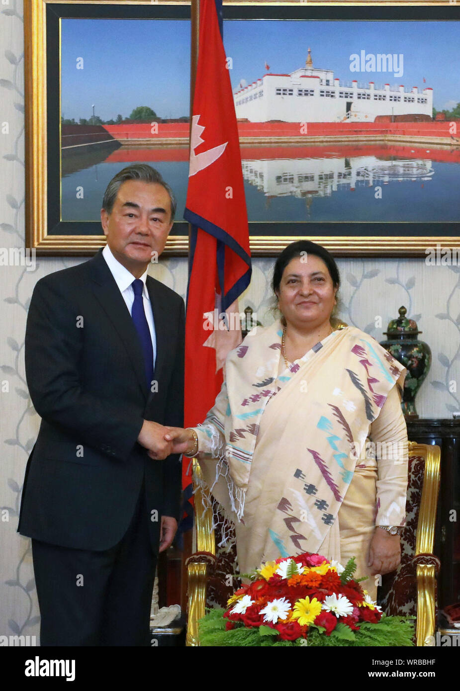 Kathmandu, Nepal. 9th Sep, 2019. Nepalese President Bidhya Devi Bhandari (R) shakes hands with visiting Chinese State Councilor and Foreign Minister Wang Yi during their meeting in Kathmandu, Nepal, Sept. 9, 2019. Credit: Sunil Sharma/Xinhua Stock Photo