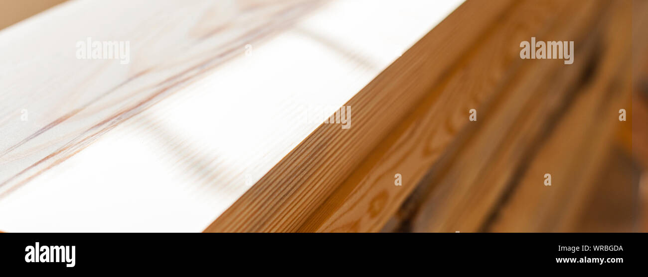 fresh planed wooden boards in joinery softwood pine wood Stock Photo