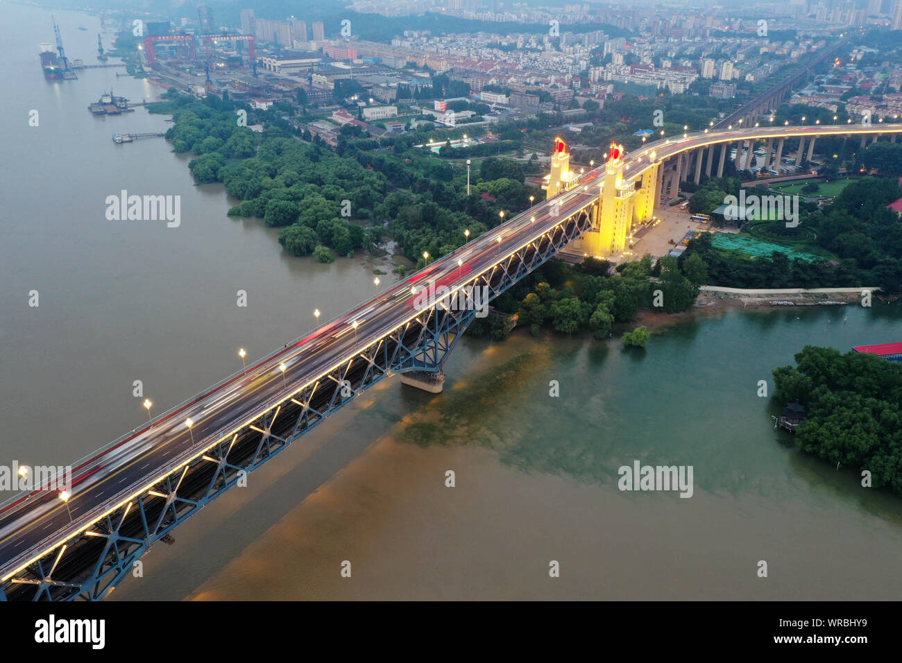 An aerial view at night of the Nanjing Yangtze River Bridge over the Yangtse River in Nanjing City, east China's Jiangsu Province, July 21st, 2019. Stock Photo