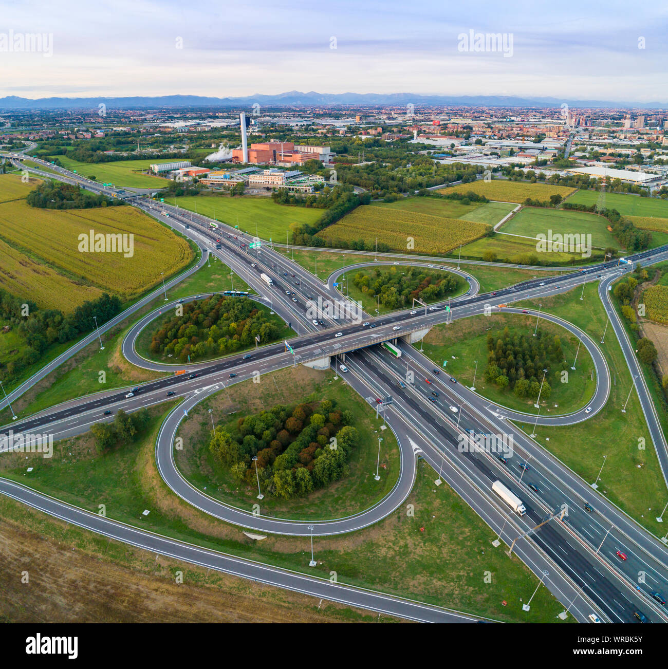Cloverleaf interchange seen from above. Aerial view of highway road junction in the countryside. Bird's eye view. Stock Photo