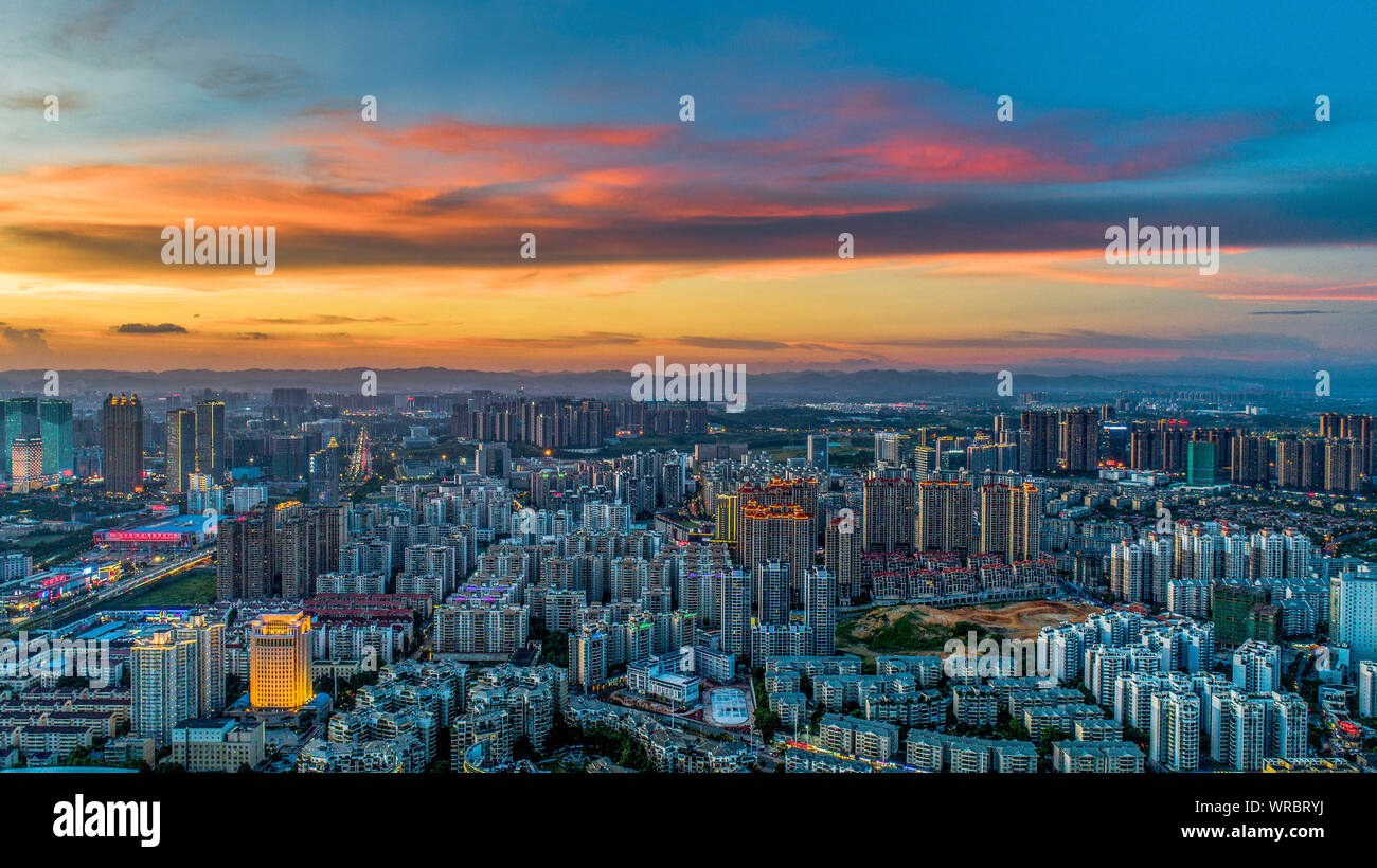 A cityscape at sunset of Qingxiu District with clusters of skyscrapers, high-rise buildings in Nanning City, south China's Guangxi Zhuang Autonomous R Stock Photo