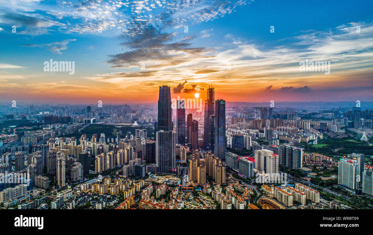A cityscape at sunset of ASEAN Business District with clusters of skyscrapers, high-rise buildings in Nanning City, south China's Guangxi Zhuang Auton Stock Photo