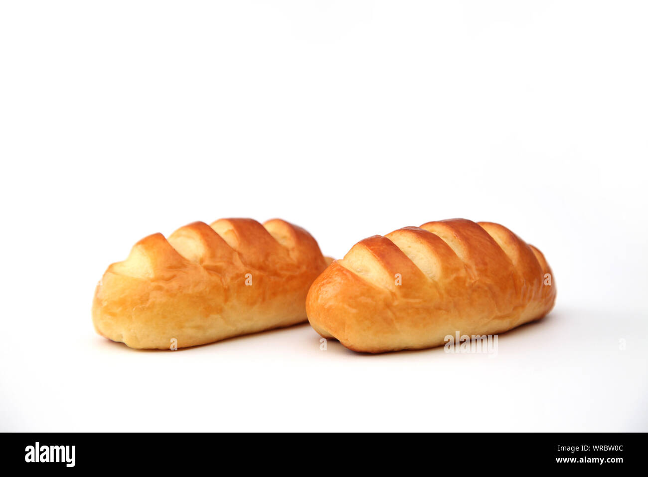 butter bread roll closeup isolated on white background Stock Photo Alamy