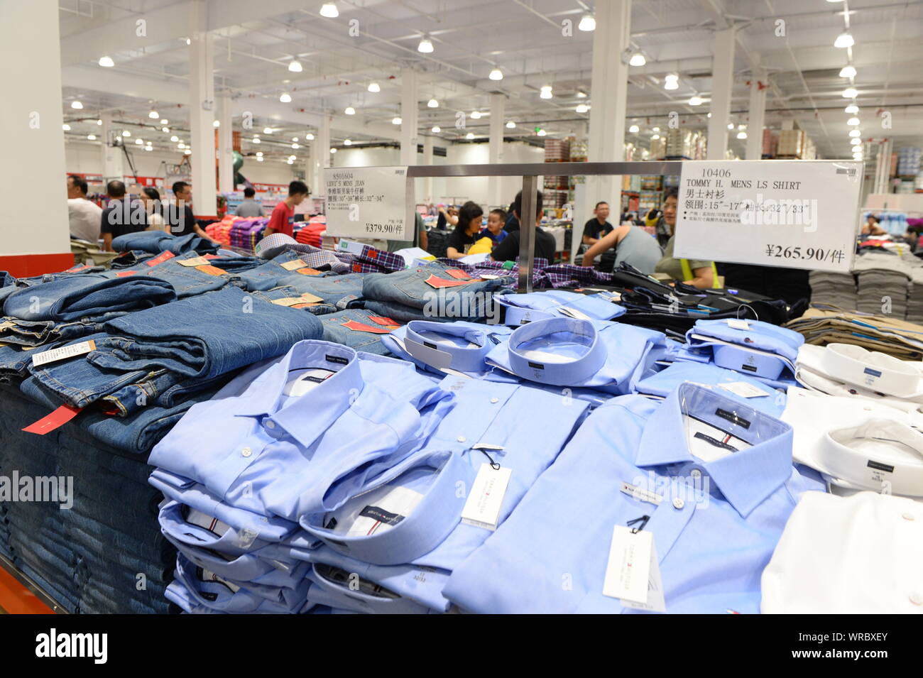 Chinese shoppers buy clothes at the Costco store in Shanghai, China on
