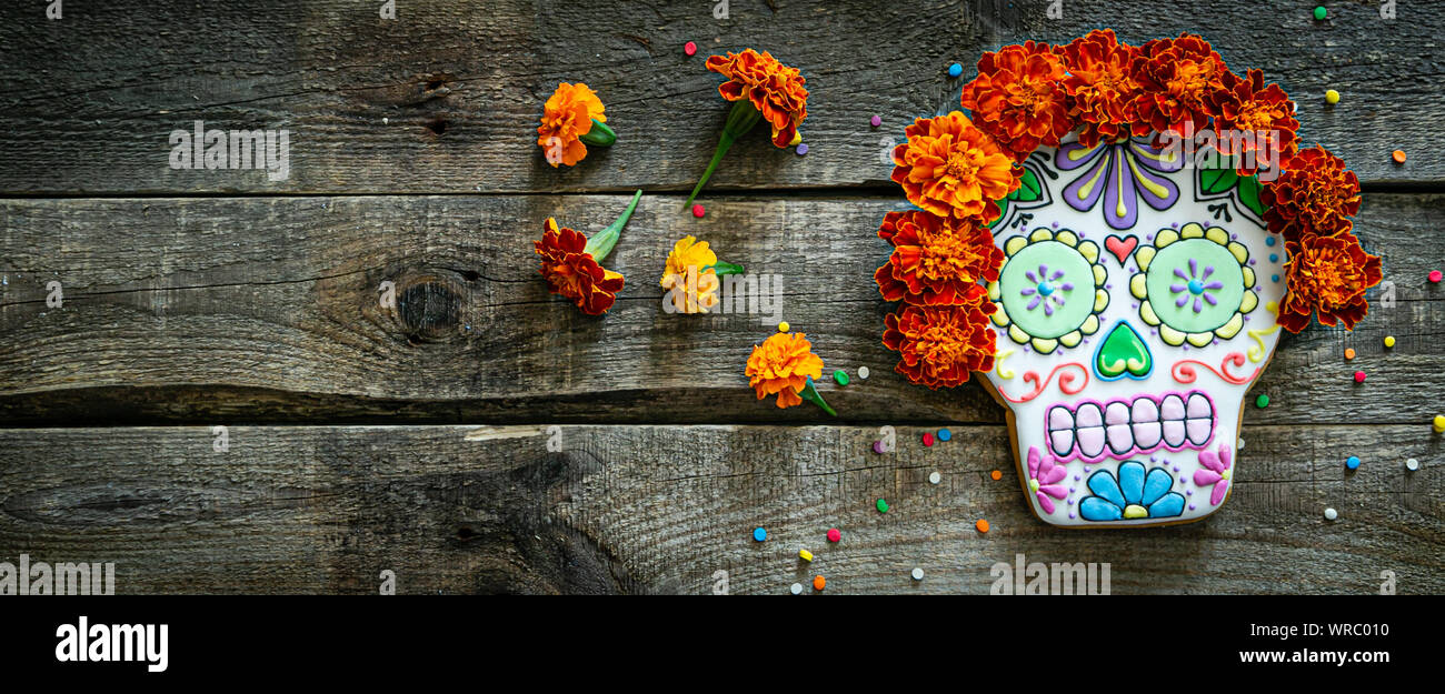 Day of the dead concept dia de los muertos - skull shapes cookie with marigold flowers Stock Photo