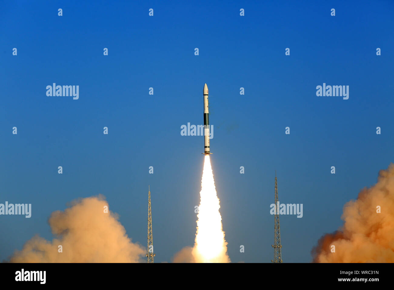 A Kuaizhou-1A (KZ-1A) carrier rocket loaded with two experimental satellites lifts off from the Jiuquan Satellite Launch Center near Jiuquan City, nor Stock Photo