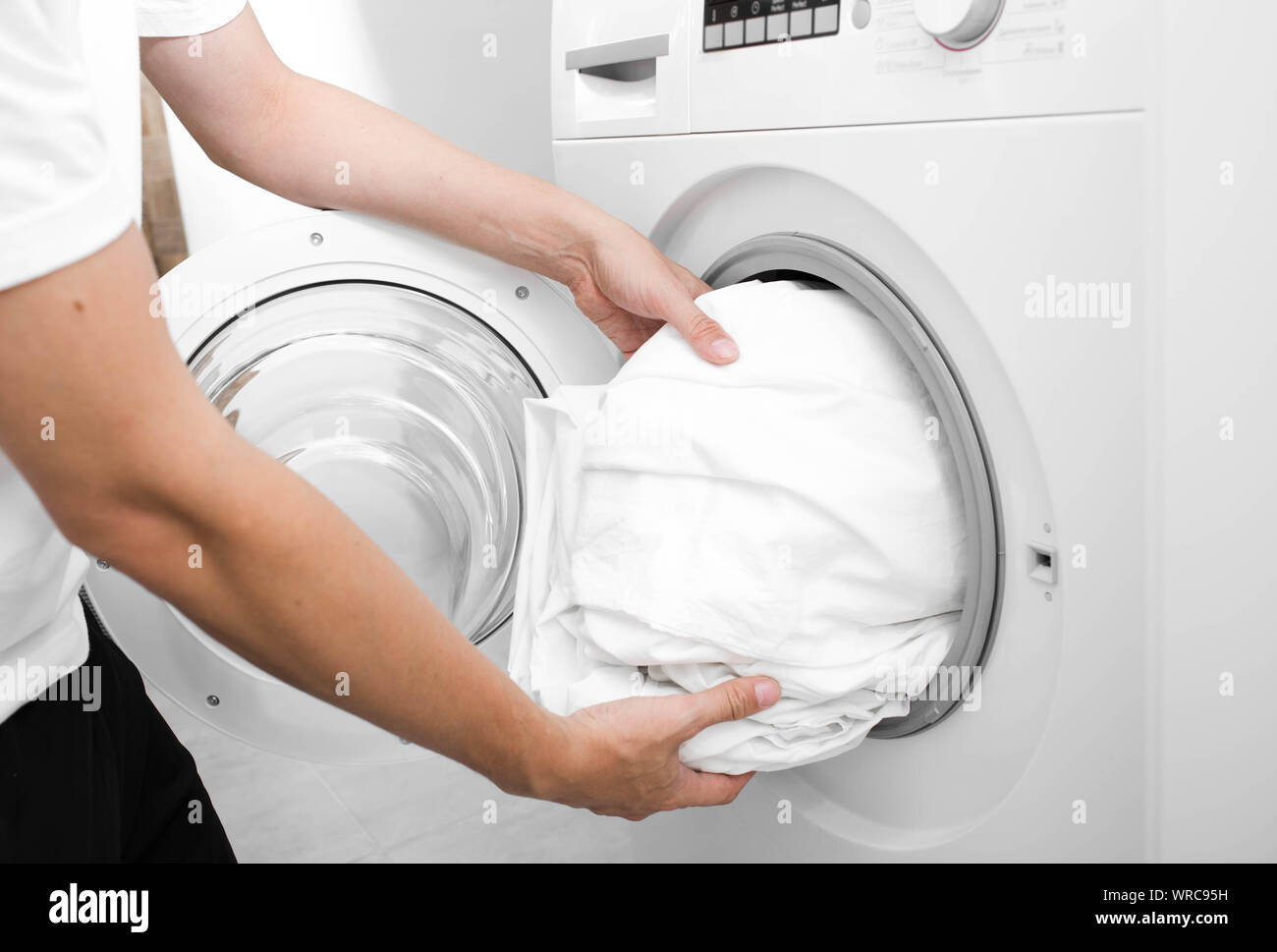 Man washing clothes by hand hires stock photography and images Alamy