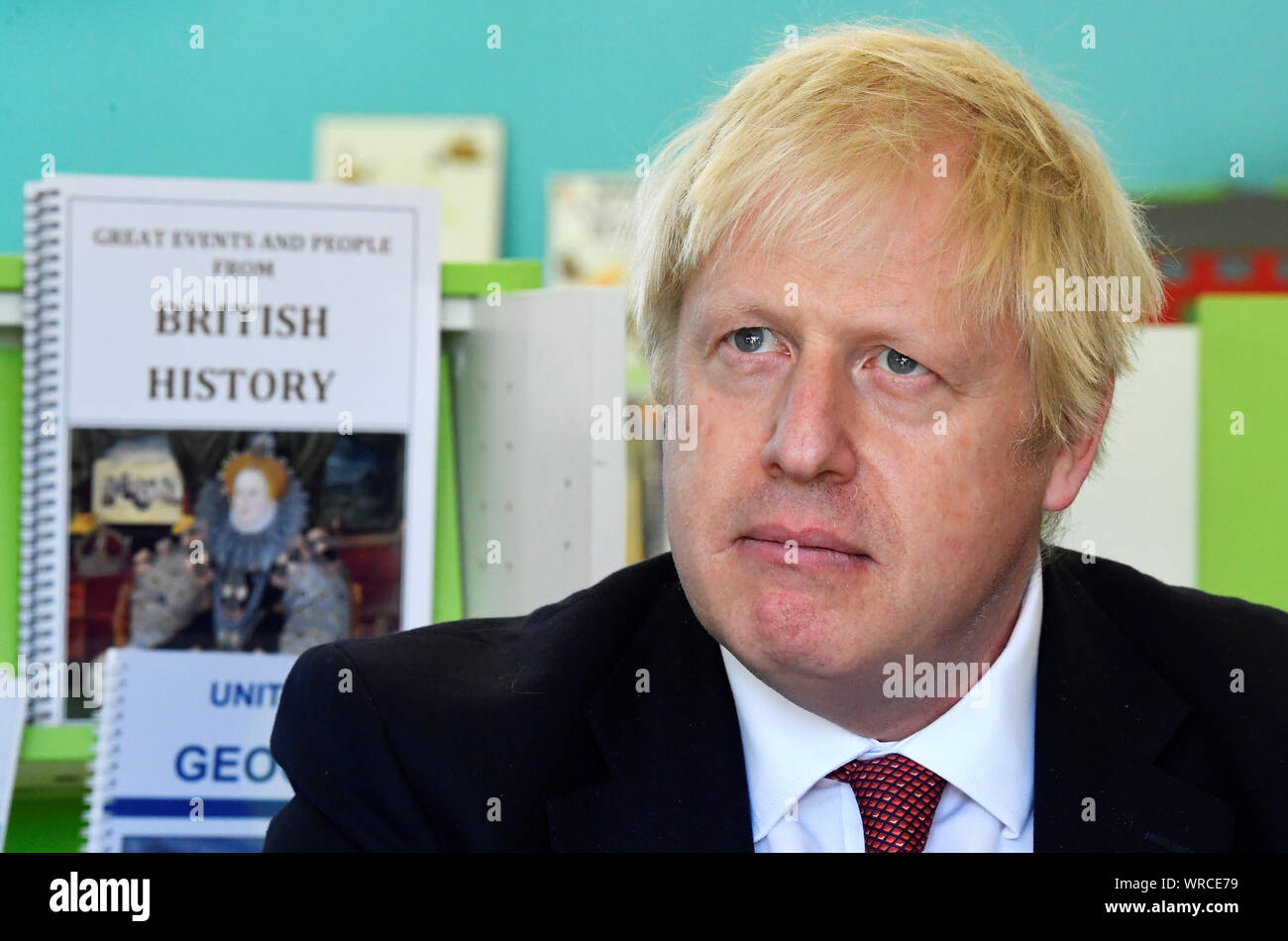 Prime Minister Boris Johnson speaks with year four and year six pupils during a visit to Pimlico Primary school in South West London, to meet staff and students and launch an education drive which could see up to 30 new free schools established. Stock Photo
