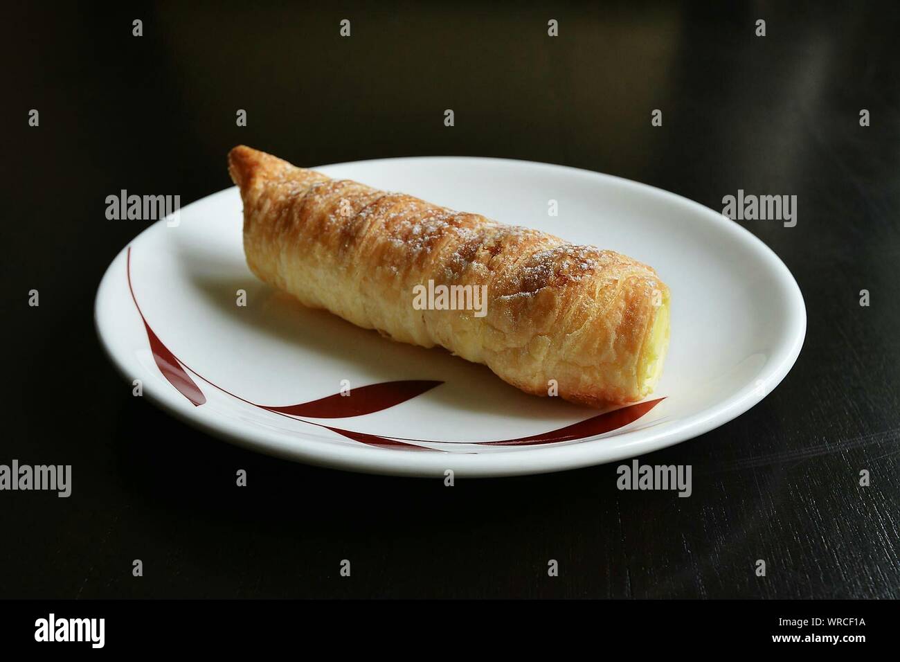 Close-up Of Fresh Baked Crunchy Bread Served In Plate On Table Stock Photo