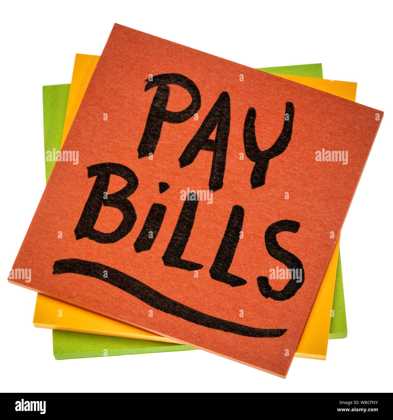 pay bills reminder - handwriting on an isolated sticky note, personal finance concept Stock Photo