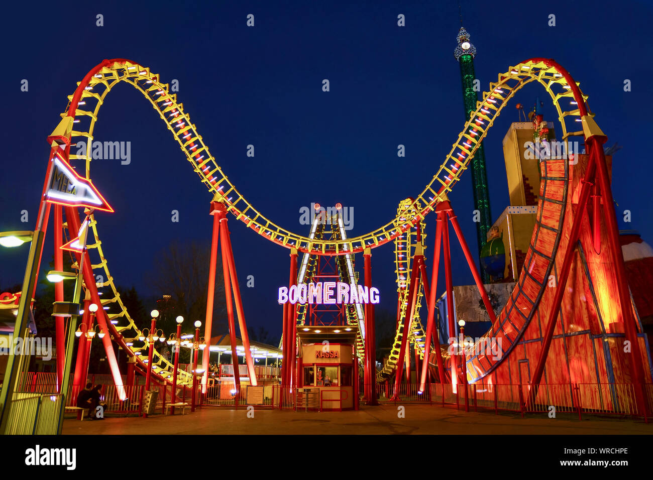 VIENNA, AUSTRIA - MARCH 8,2014:  The BOOMERANG roller coaster at night in Wurstelprater, an amusement park and section of the Wiener Prater. Stock Photo
