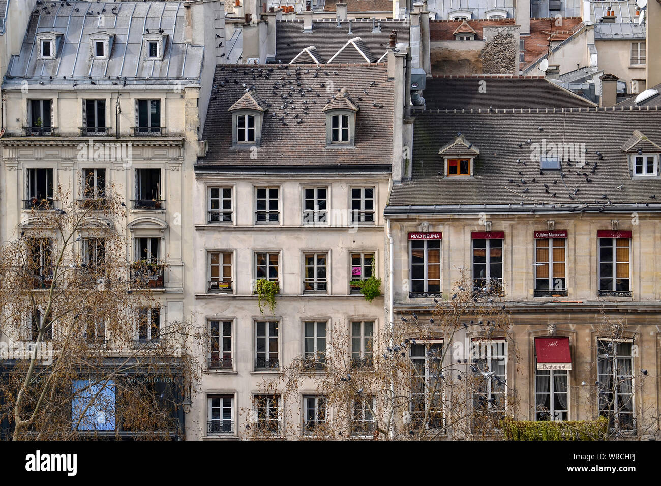 PARIS, FRANCE - MARCH 19, 2014: view of typical parisian building facades taken from the Pompidou Centre in the Beaubourg area. Stock Photo