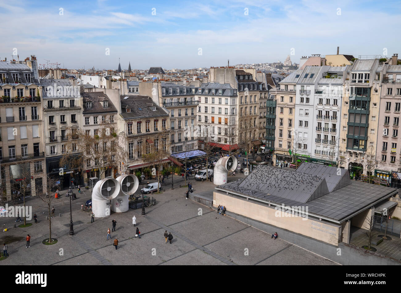 PARIS, FRANCE - MARCH 19, 2014: stunning view of Paris (Sacré-Cœur Basilica in the background) taken from the Pompidou Centre in the Beaubourg area. Stock Photo