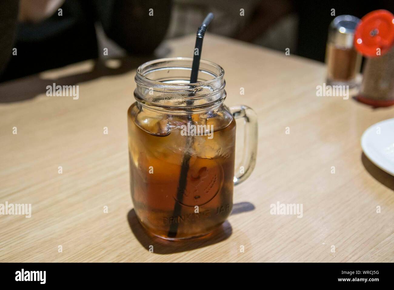 High Angle View Of Ice Tea With Lemon In Glass On Wooden Table Stock Photo