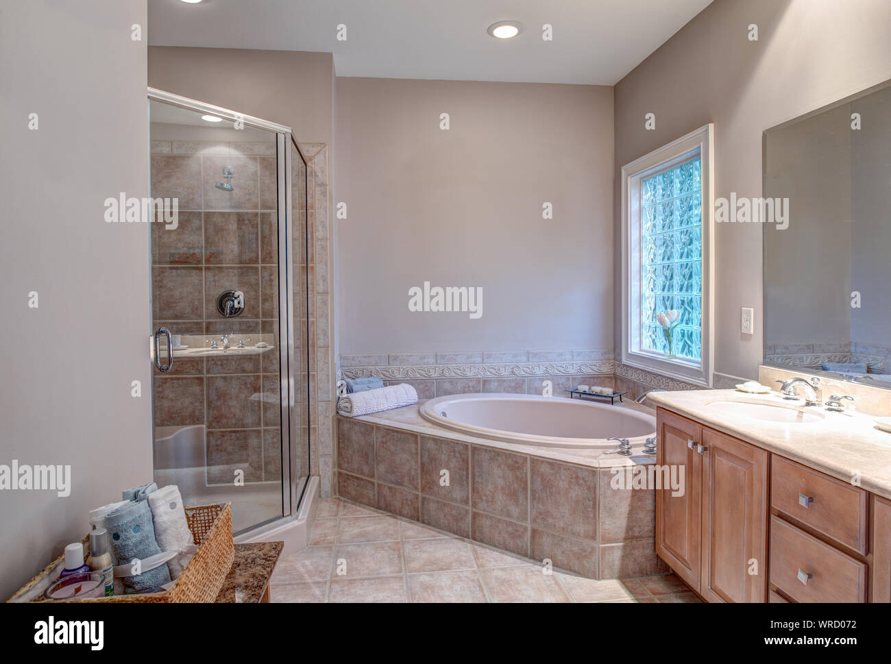 Beautiful bathroom with whirlpool bathtub and separate shower. Stock Photo