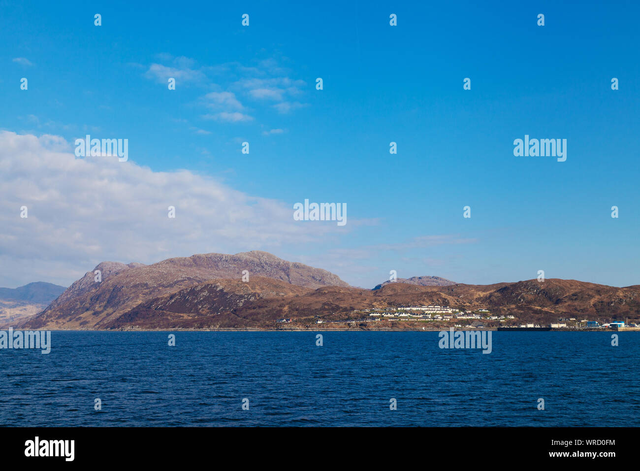 The harbour town of Mallaig in the Highlands of Scotland from a ferry heading to Rum. Stock Photo