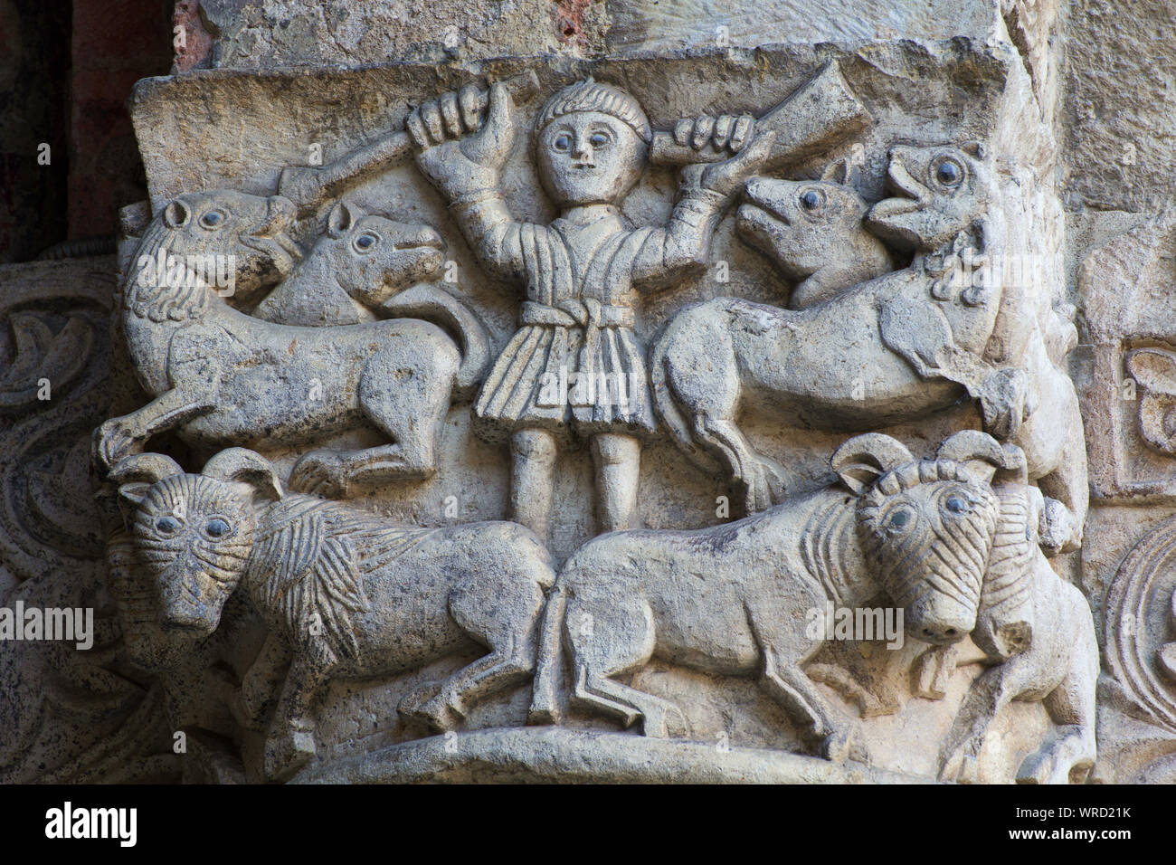 A man (Orpheus?) taming wild beasts with music and his chant - Romanesque-style capital - Atrium of Ansperto - Basilica of Sant'Ambrogio - Milan Stock Photo