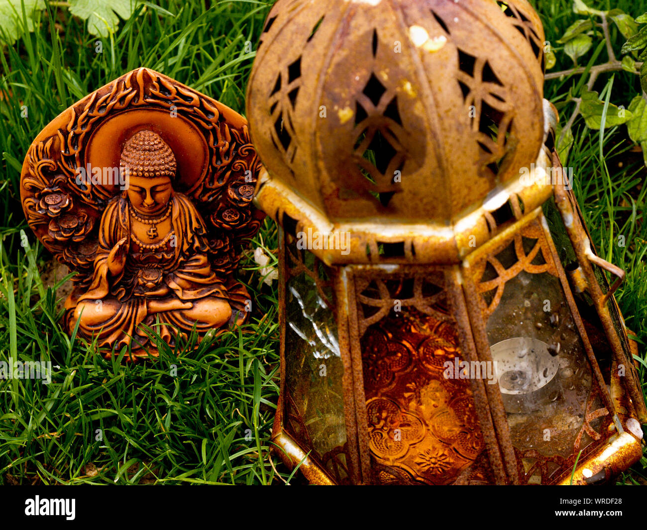 High Angle View Of Religious Sculpture On Grassy Field Stock Photo