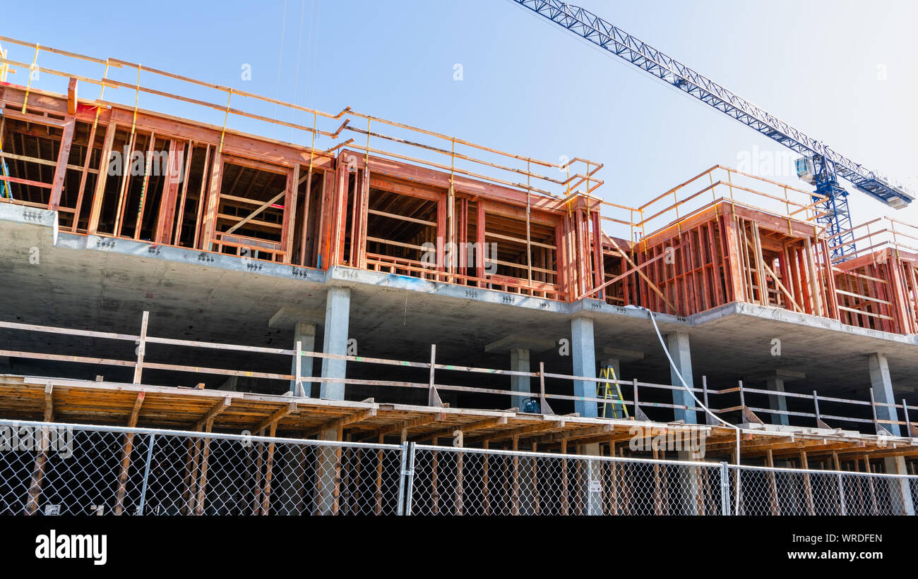 Multifamily residential building under construction in San Jose; the entire Silicon Valley and San Francisco Bay Area has faced a housing crisis, with Stock Photo