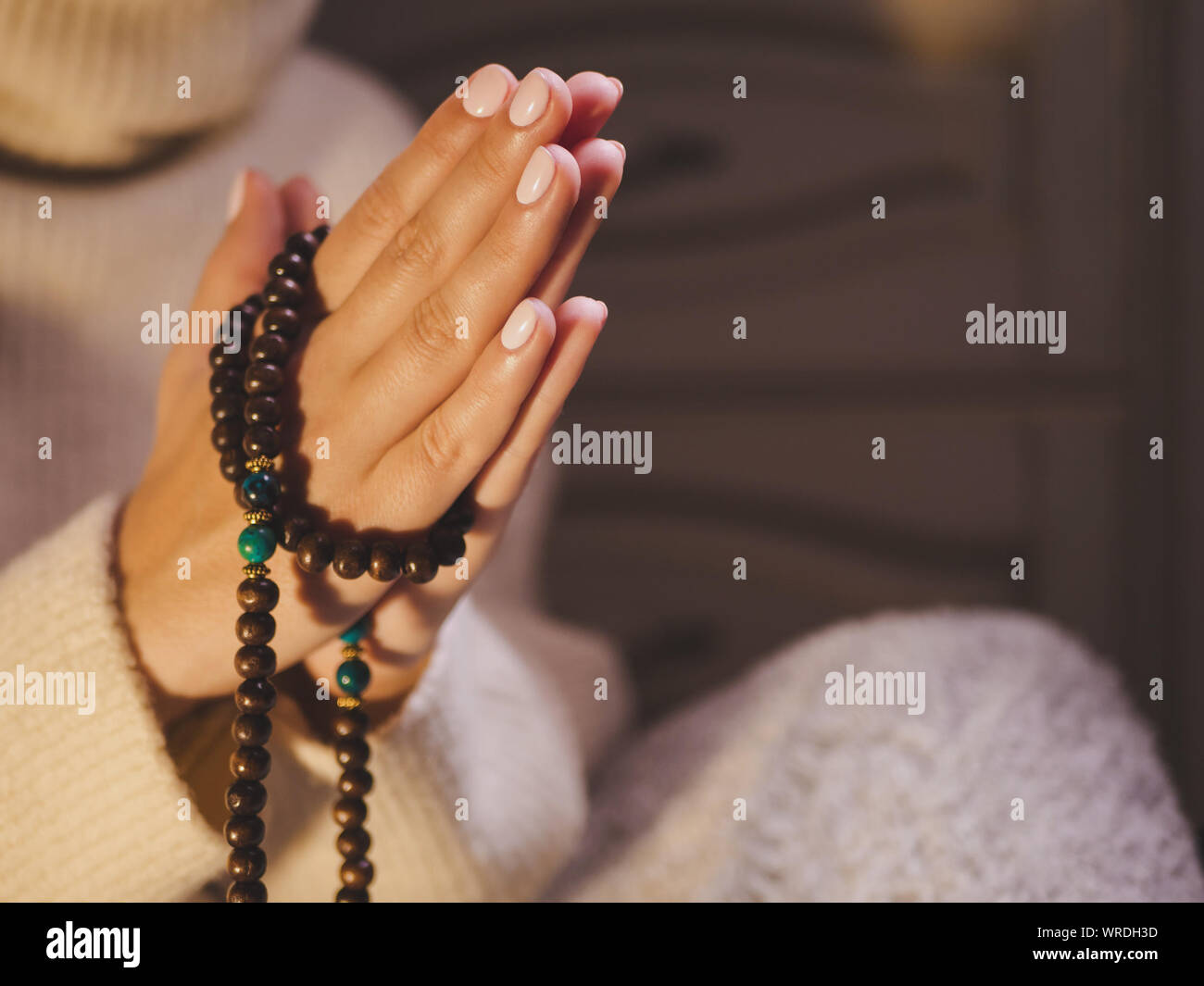 Hands with rosary beads hi-res stock photography and images - Alamy