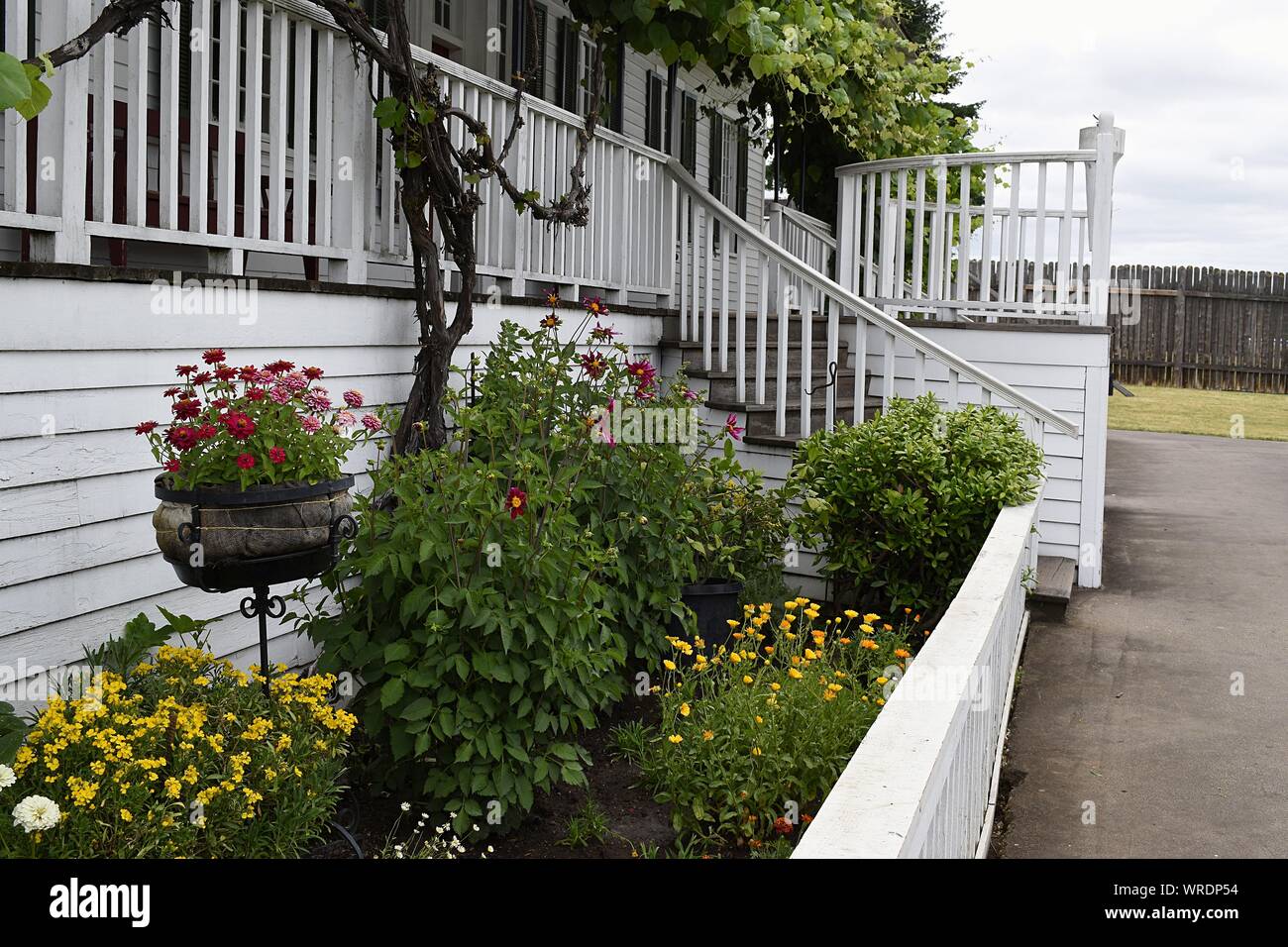 Vancouver, WA USA – June 14, 2019: Keeping up proper British standards the Chief Factor's Residency is still decorated with flower beds. Stock Photo