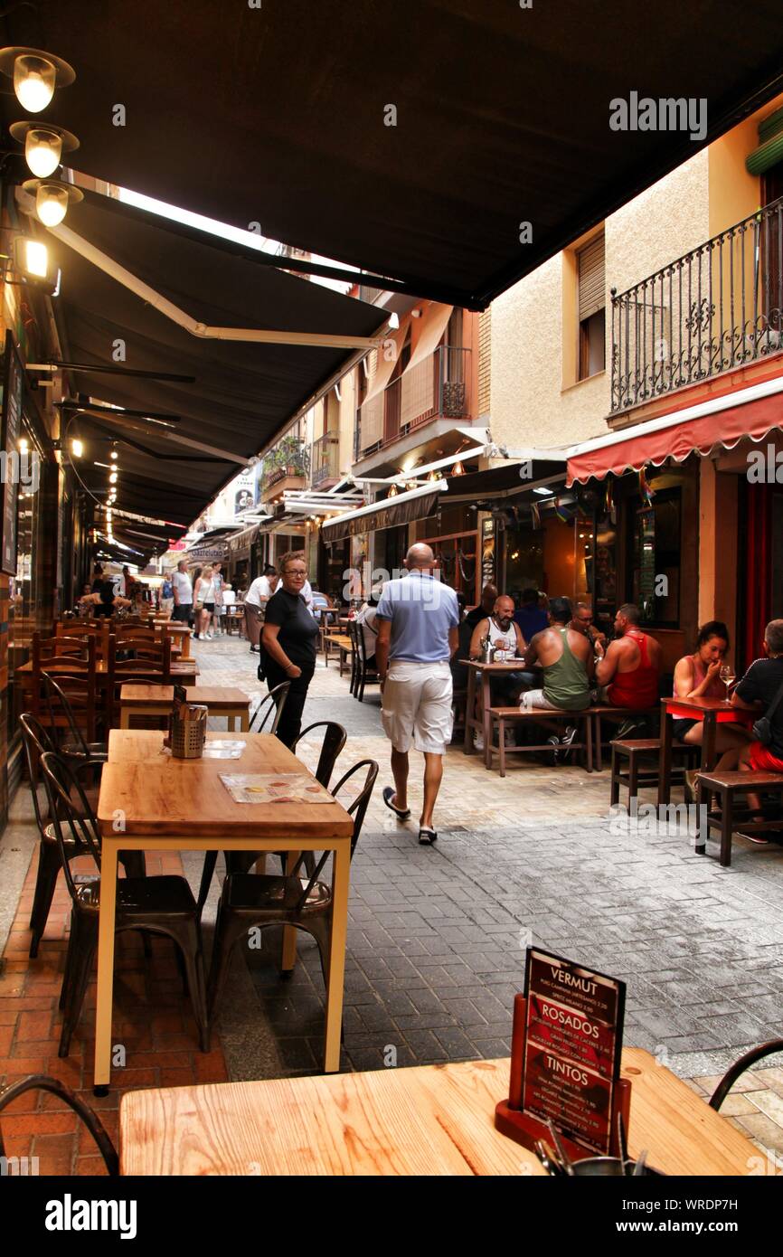 Benidorm, Alicante, Spain- September 7, 2019: Bar of typical spanish food full of people in the old town of Benidorm Stock Photo