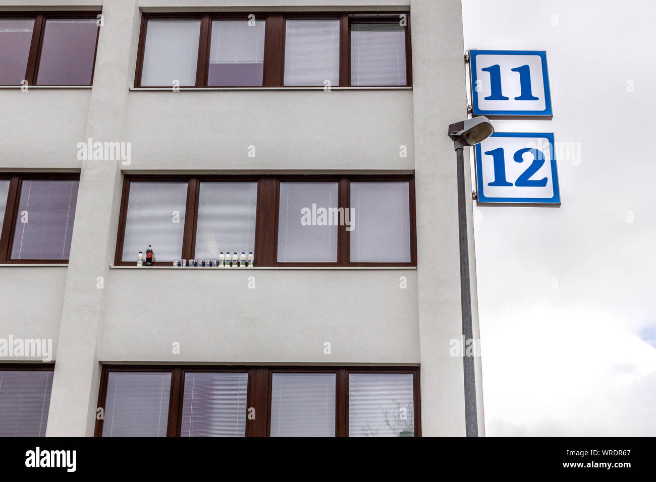 Strahov dormitory - keeping drinks cold outside on the window sill. Student accommodation near the famous Strahov stadium, Prague, Czech Republic Stock Photo