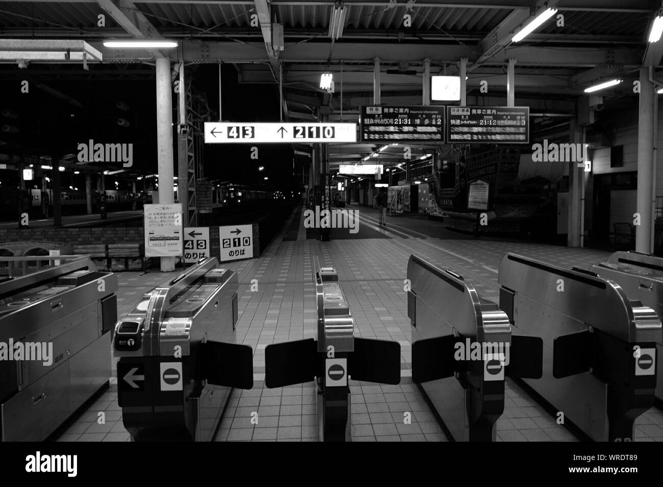 Turnstile At Illuminated Railroad Station Stock Photo - Alamy