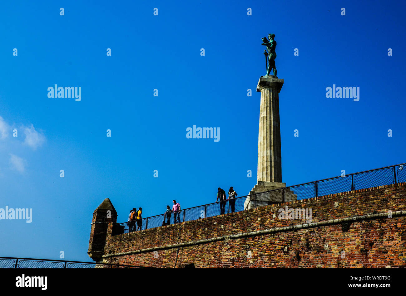 Low Angle View Of Pobednik At Belgrade Fortress Against Blue Sky Stock Photo