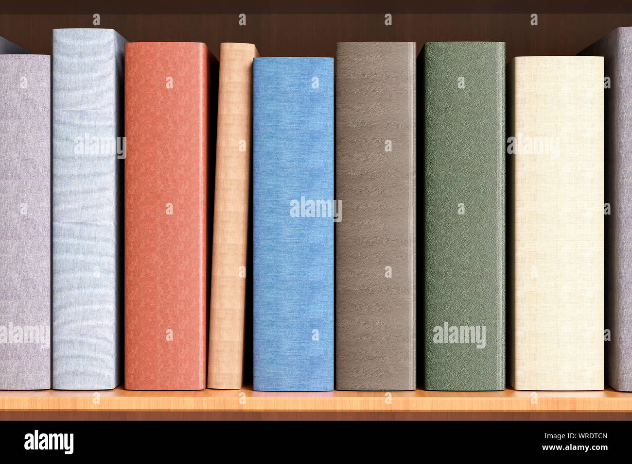 Hardback books with a blank spine on a bookshelf close up Stock Photo