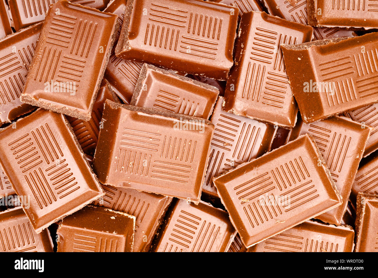 Milk Chocolate pieces, close up, overhead view Stock Photo
