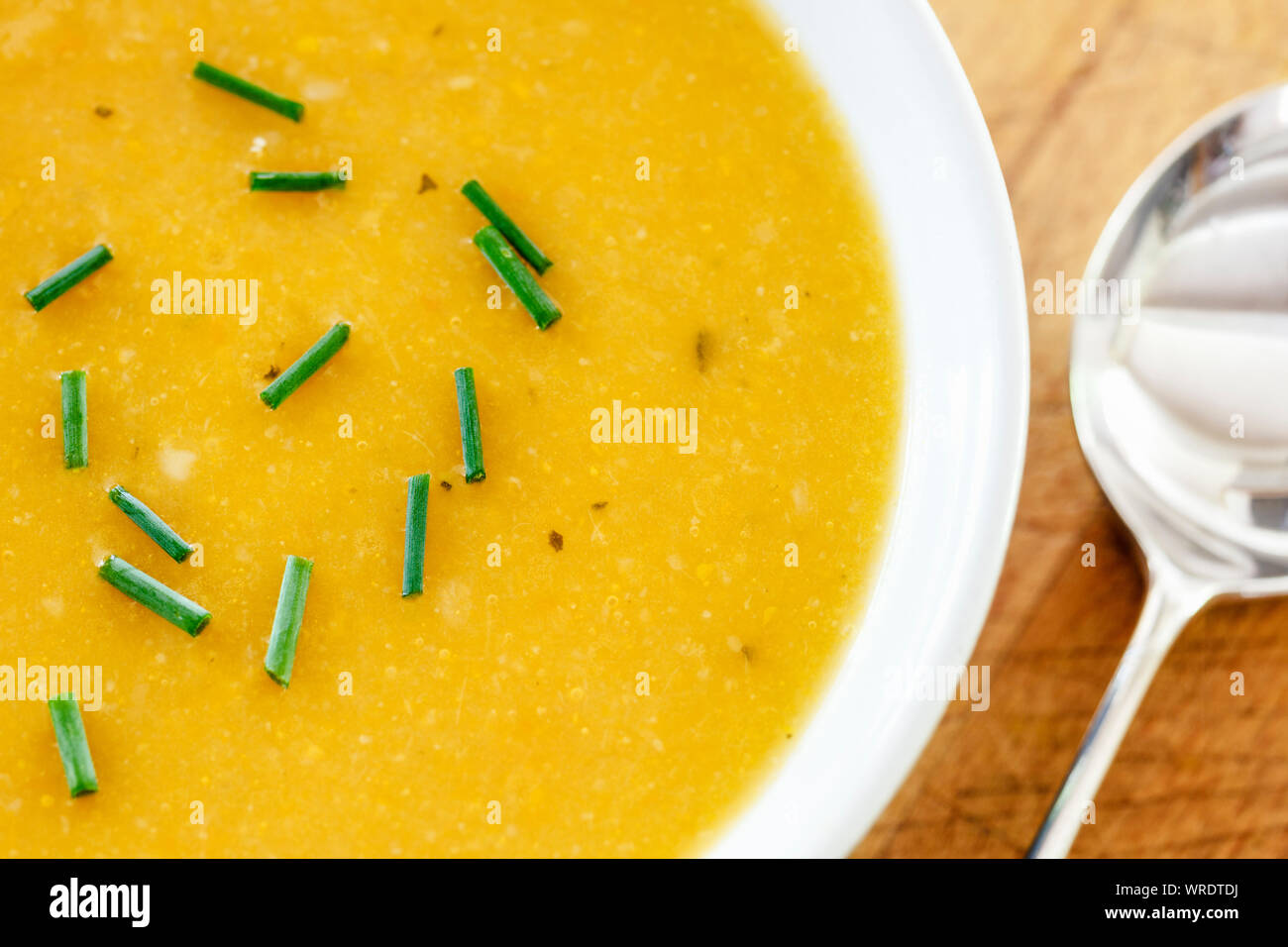 Bowl of fresh vegetable soup with chopped chives Stock Photo