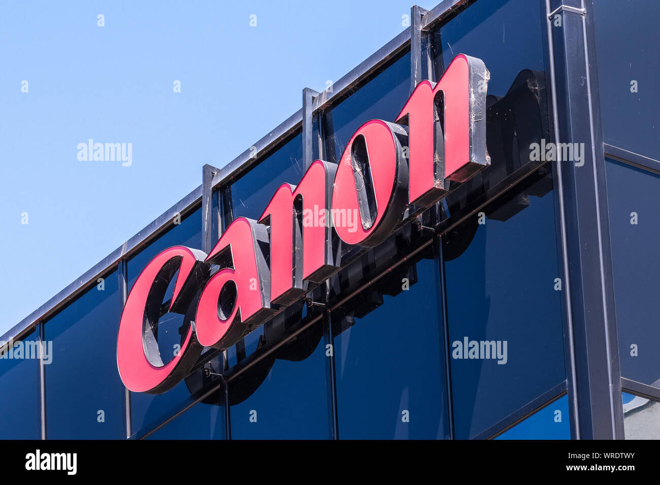 Sep 9, 2019 San Jose / CA / USA - Canon sign at the Canon Solutions America (wholly owned subsidiary of Canon USA Inc.) offices in Silicon Valley; Can Stock Photo