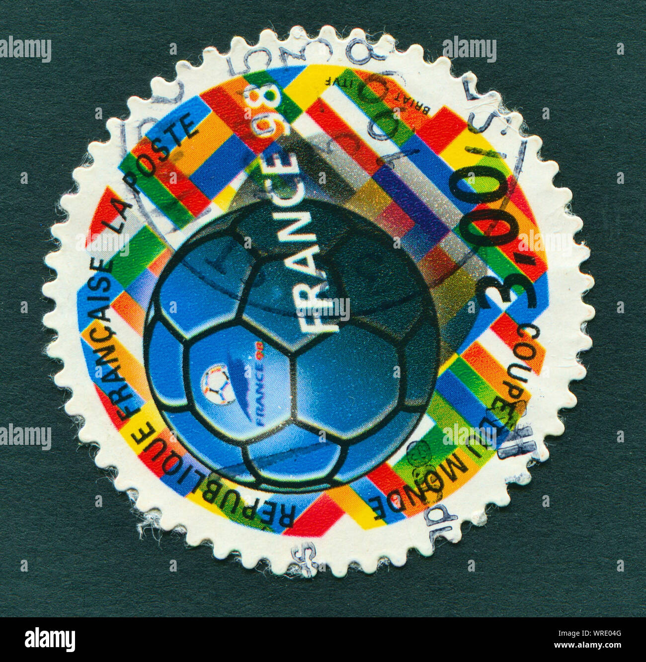 FIFA WORLD CUP 1998 in France - a stamp showing football. Stock Photo
