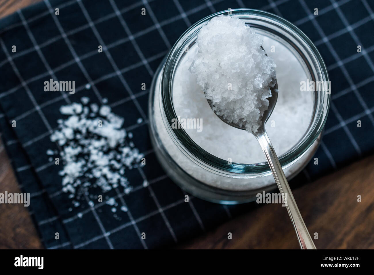 Maldon Sea Salt flakes in Jar with Spoon. Organic Food Product Stock