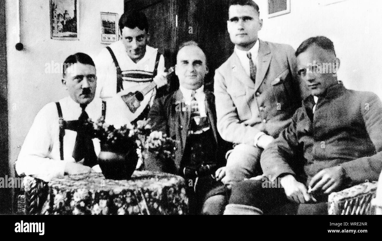 Adolf Hitler among his friends in a pub in Munich Stock Photo
