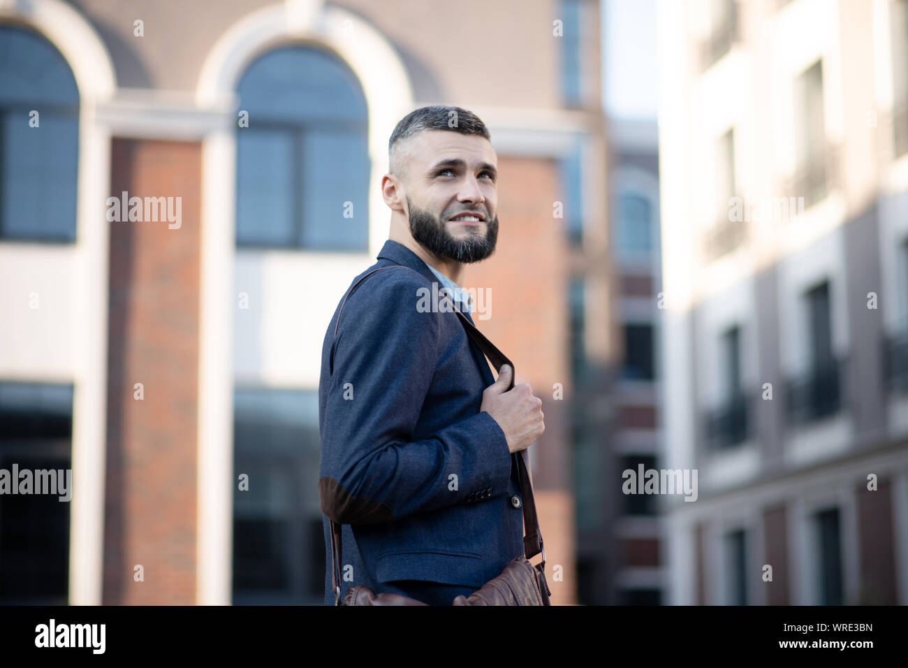Man having good mood while walking to office in the morning Stock Photo