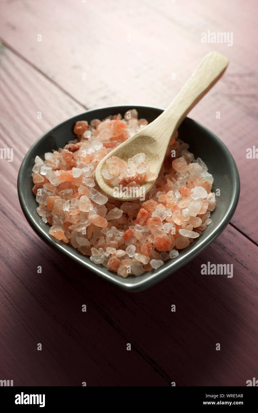 Himalayan salt on a wood table Stock Photo Alamy