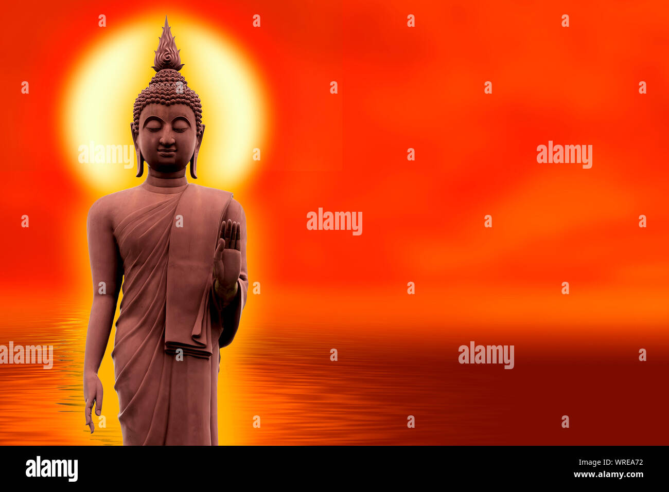 The Buddha stands gracefully on a lotus flower with an orange background.(About Buddhism) Stock Photo