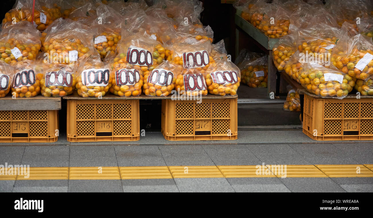 A counter with tangerines (Japanese mikans) along the road of Kii