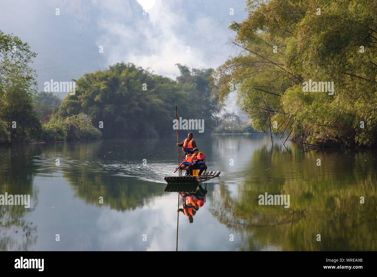 Amazing natural landscape. Beautiful karst mountains reflected in the water of Yulong river, in Yangshuo, Guangxi province, China. Stock Photo