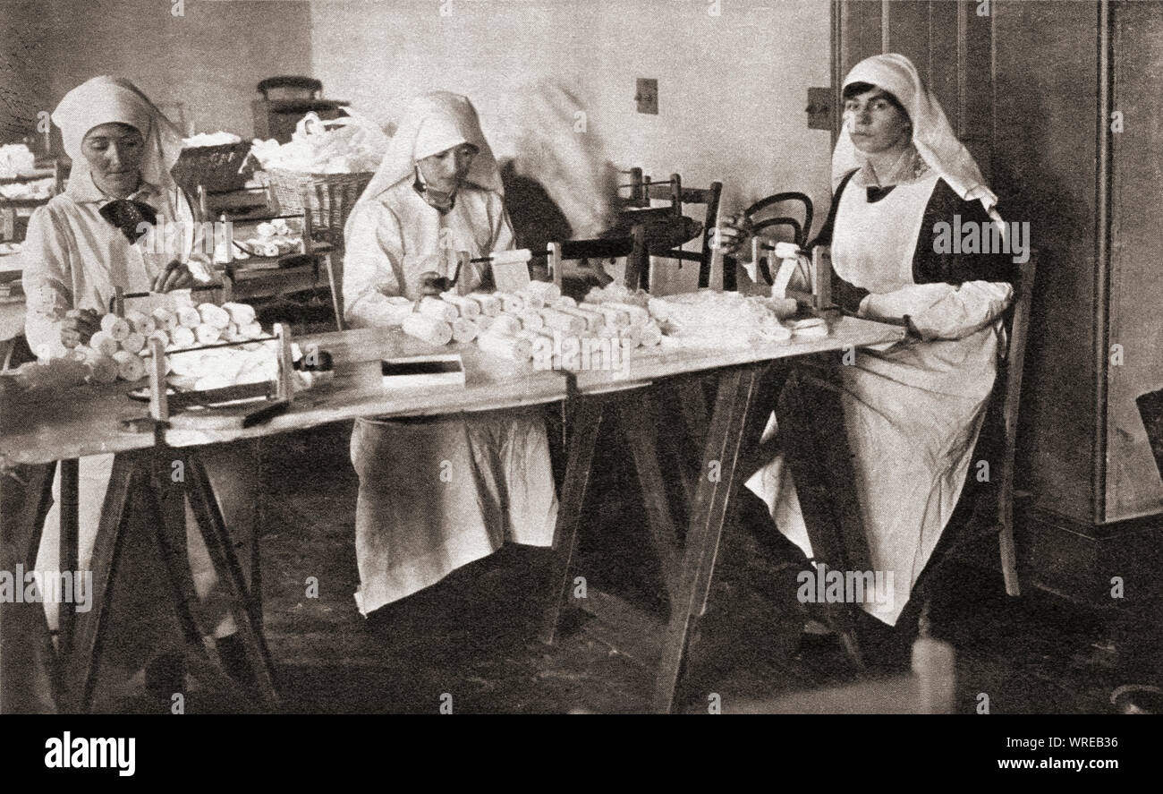 Women volunteers making hospital requisites for the St. John Ambulance Brigade hospital during WWI.  From The Pageant of the Century, published 1934. Stock Photo