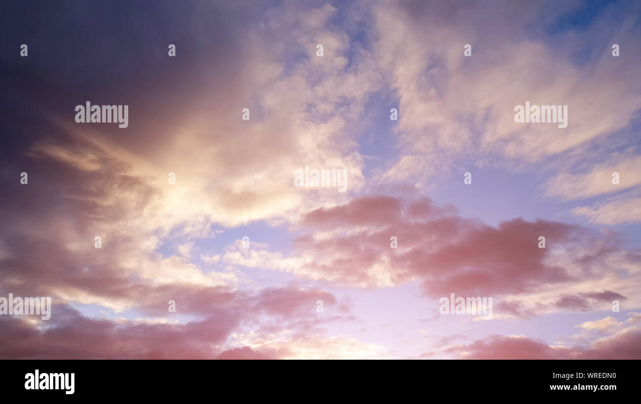 beautiful pink sunset and sky with clouds and sunlight Stock Photo - Alamy
